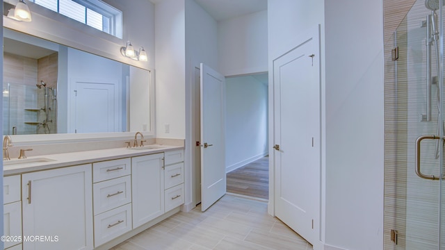 7 Ashlynn Ct, Manalapan, NJ 07726 - full bathroom with double vanity, tile patterned flooring, a stall shower, and a sink