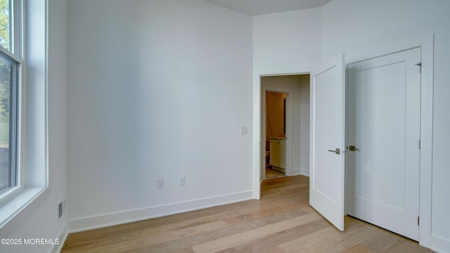7 Ashlynn Ct, Manalapan, NJ 07726 - unfurnished bedroom with light wood finished floors, visible vents, and baseboards