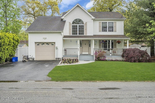 334 E Cape May Ave, Ocean Gate, NJ 08740 - view of front facade featuring a garage, a porch, asphalt driveway, a front lawn, and roof with shingles