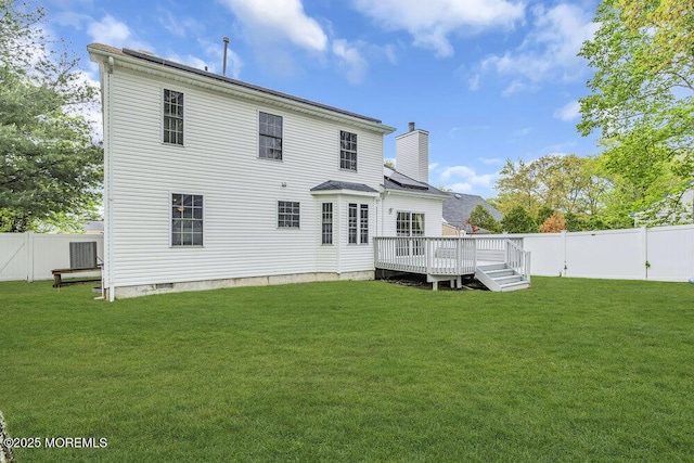 334 E Cape May Ave, Ocean Gate, NJ 08740 - back of property with a chimney and a wooden deck