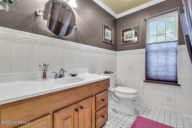 334 E Cape May Ave, Ocean Gate, NJ 08740 - full bathroom with crown molding, tile walls, toilet, wainscoting, and vanity
