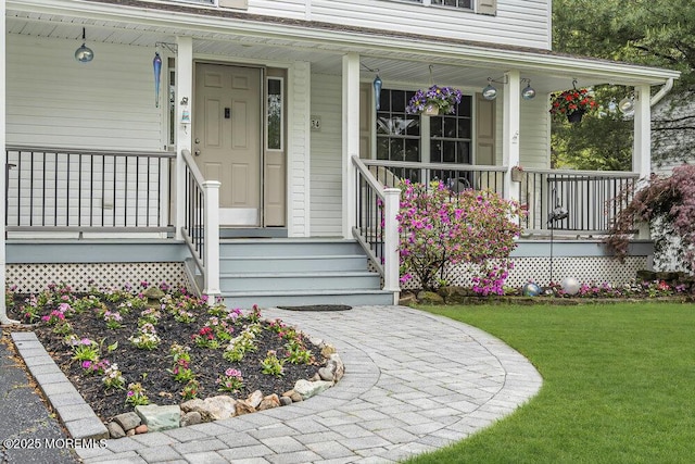 334 E Cape May Ave, Ocean Gate, NJ 08740 - entrance to property featuring covered porch and a yard