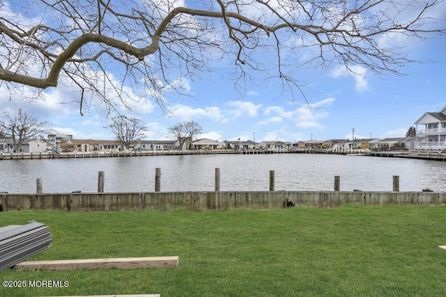 property view of water featuring a boat dock and a residential view