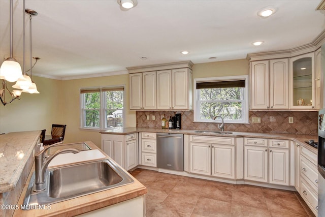 kitchen with a sink, stainless steel dishwasher, and plenty of natural light