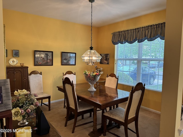14 Pelican Ln, Little Egg Harbor, NJ 08087 - carpeted dining space with baseboards and a chandelier