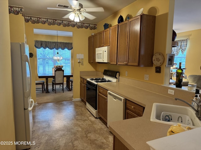 14 Pelican Ln, Little Egg Harbor, NJ 08087 - kitchen featuring white appliances, a sink, a ceiling fan, and healthy amount of natural light