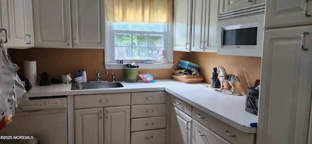 95 Gravel Hill Spotswood Rd, Monroe, NJ 08831 - kitchen with a sink, white microwave, light countertops, and white cabinets