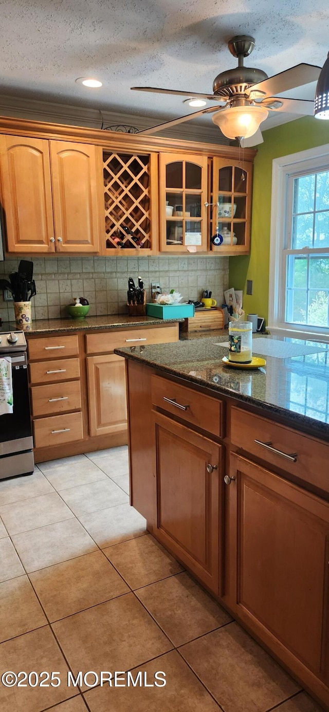95 Gravel Hill Spotswood Rd, Monroe, NJ 08831 - kitchen featuring electric stove, backsplash, glass insert cabinets, dark stone counters, and a textured ceiling