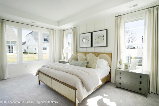 bedroom featuring baseboards, visible vents, and carpet floors