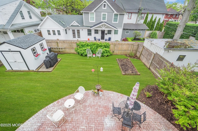 view of yard with a patio, a shed, and an outdoor structure
