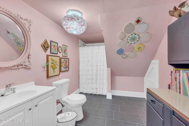 full bath with toilet, vanity, tile patterned floors, and a shower with shower curtain