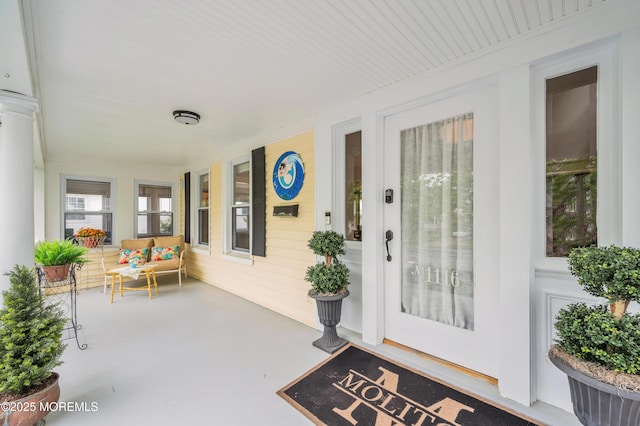 doorway to property featuring a porch