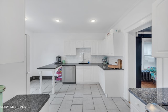 kitchen featuring dishwasher, white cabinetry, crown molding, backsplash, and light tile patterned flooring