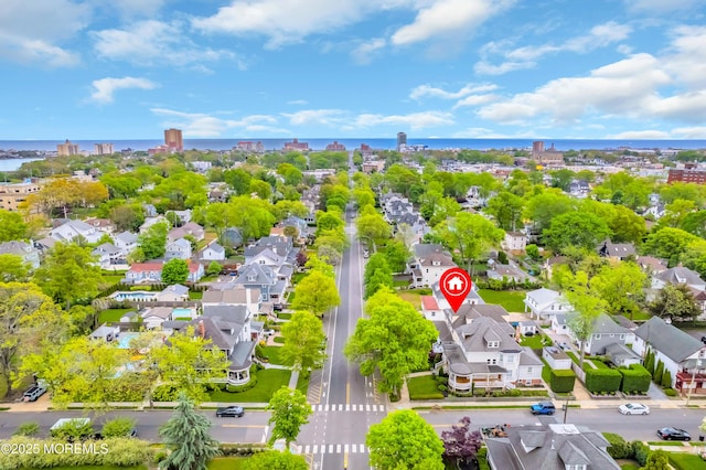 aerial view of residential area with a nearby body of water