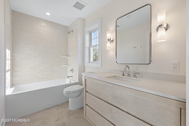 full bath featuring toilet, washtub / shower combination, and vanity