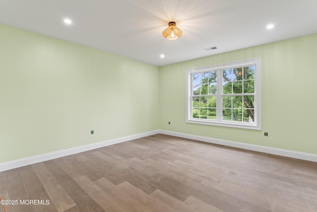 38 Louise Dr, East Brunswick, NJ 08816 - spare room with baseboards, wood finished floors, and recessed lighting