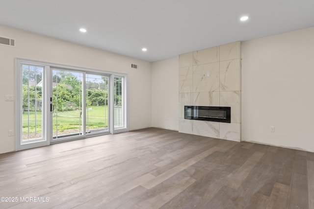 38 Louise Dr, East Brunswick, NJ 08816 - unfurnished living room with wood finished floors, a premium fireplace, recessed lighting, and heating unit