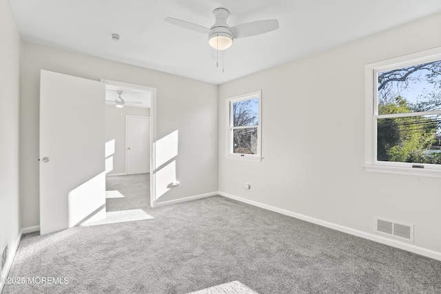 555 Cedar Ave, West Long Branch, NJ 07764 - unfurnished bedroom with multiple windows, carpet flooring, baseboards, and a ceiling fan