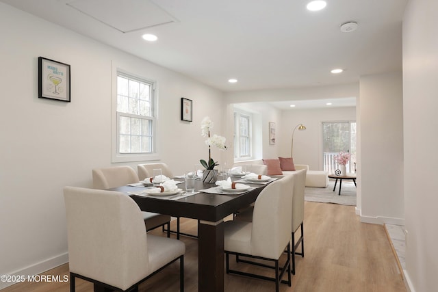dining room featuring baseboards, a wealth of natural light, recessed lighting, and light wood-type flooring