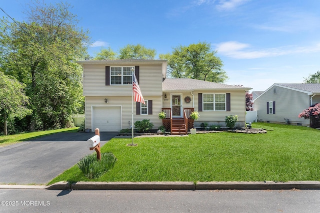 2015 Red Cedar St, Toms River, NJ 08753 - tri-level home with driveway, an attached garage, and a front yard