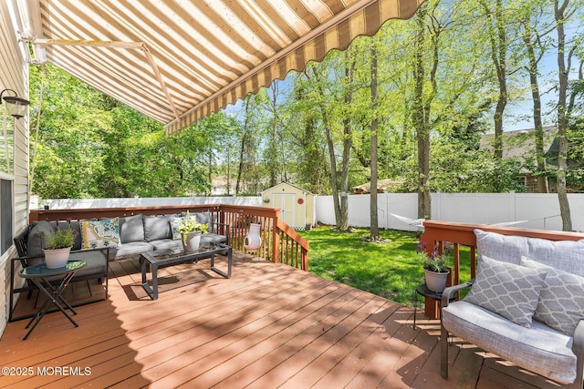 2015 Red Cedar St, Toms River, NJ 08753 - wooden deck with an outdoor hangout area, a storage unit, and an outdoor structure