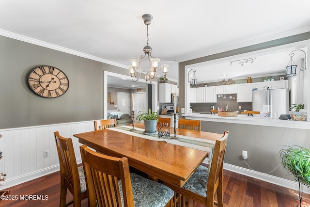 2015 Red Cedar St, Toms River, NJ 08753 - dining space featuring a chandelier, dark wood-type flooring, crown molding, and a wainscoted wall