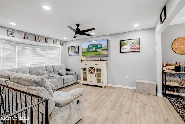 living room with wood finished floors, baseboards, ceiling fan, and recessed lighting