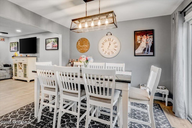 dining area with wood finished floors
