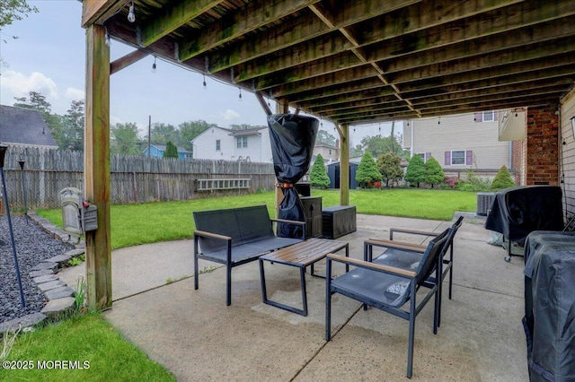 view of patio with outdoor lounge area and a fenced backyard