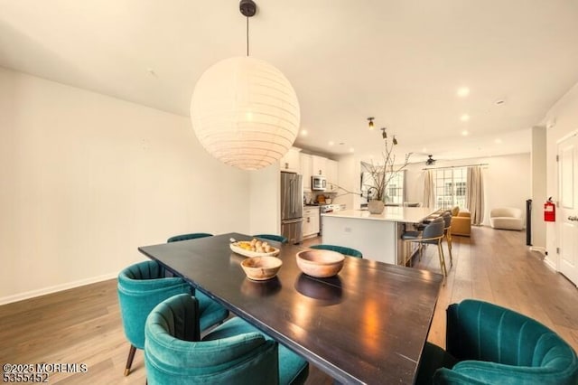2206 Evans Ln, Middletown, NJ 07748 - dining area with baseboards and light wood-style floors