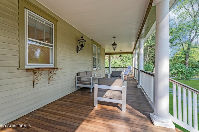 deck with an outdoor hangout area and covered porch