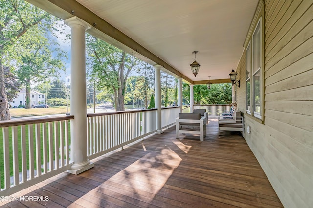 wooden terrace featuring covered porch