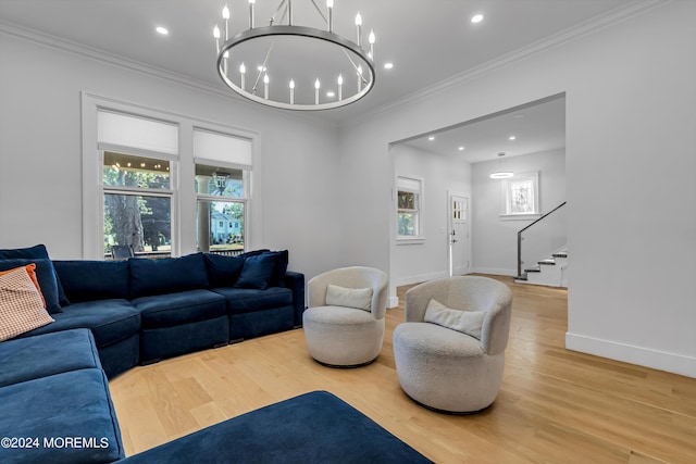 living room featuring stairway, light wood-style flooring, and plenty of natural light