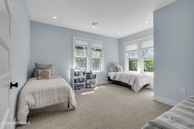 carpeted bedroom featuring visible vents, baseboards, and recessed lighting
