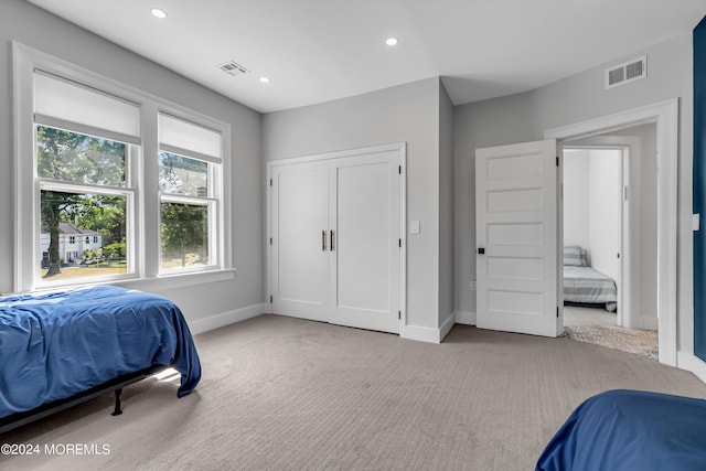 bedroom with recessed lighting, visible vents, baseboards, and light carpet