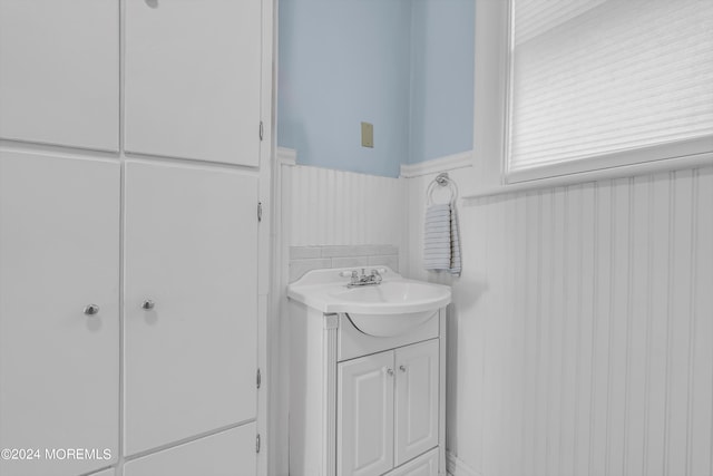 bathroom featuring vanity and wainscoting