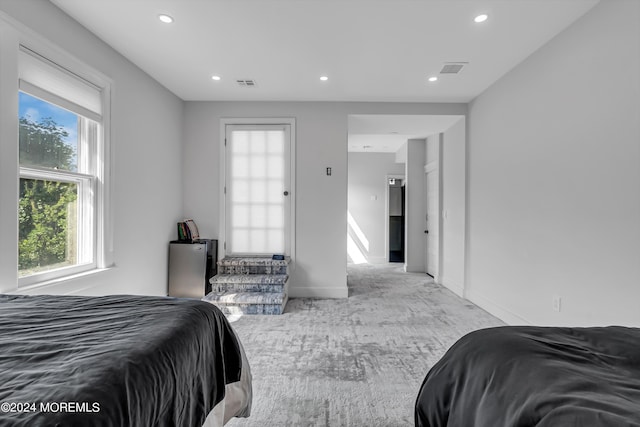 carpeted bedroom featuring baseboards, visible vents, and recessed lighting