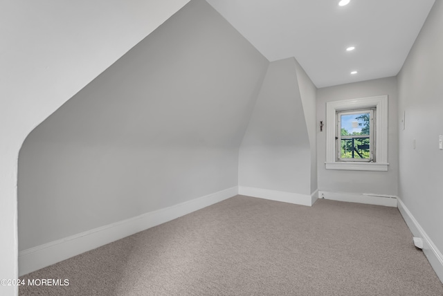 additional living space with carpet flooring, baseboards, and recessed lighting