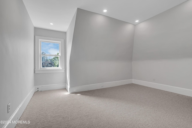 additional living space featuring carpet floors, baseboards, and recessed lighting