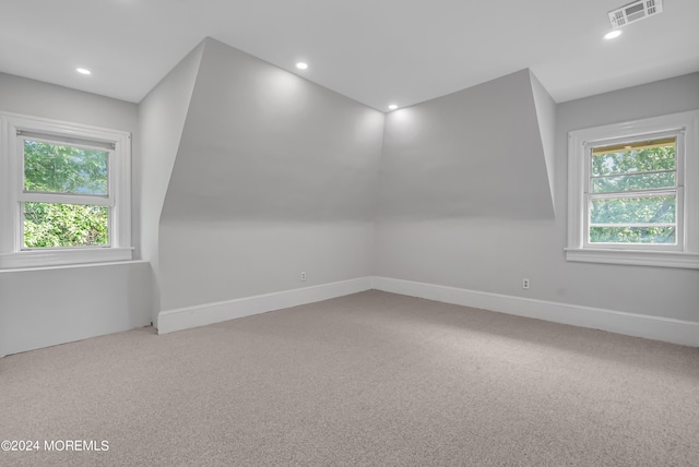 bonus room featuring carpet, recessed lighting, visible vents, and plenty of natural light