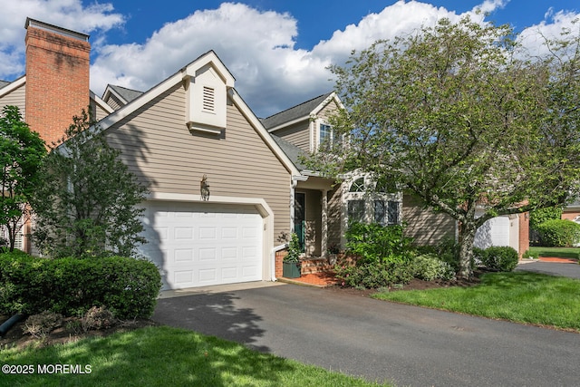 view of front facade featuring driveway and a garage