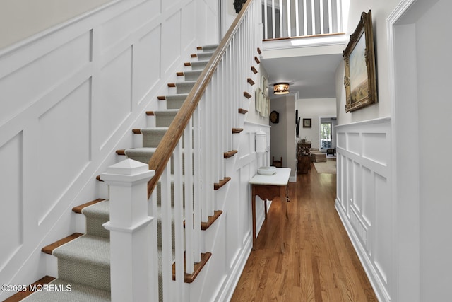 staircase with wood finished floors