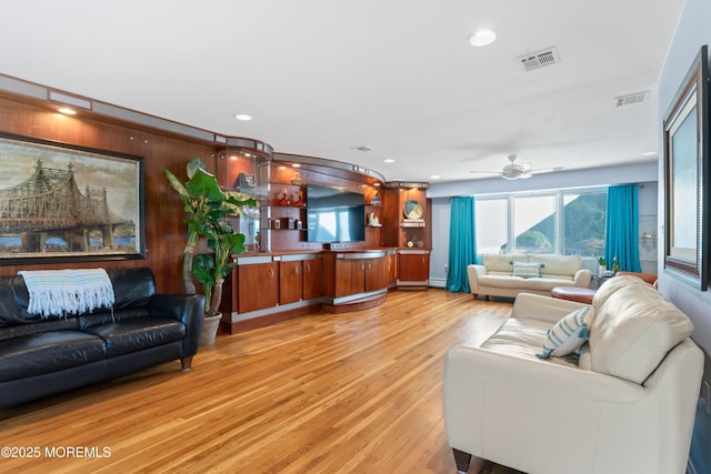 19 Dartmoor Dr, Manalapan, NJ 07726 - living room with light wood finished floors, ceiling fan, and recessed lighting