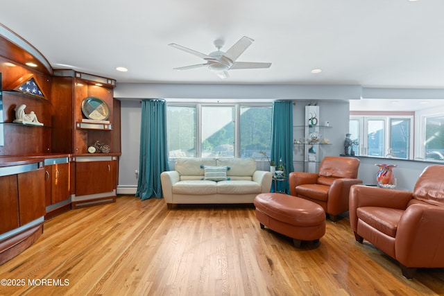 19 Dartmoor Dr, Manalapan, NJ 07726 - living room featuring healthy amount of natural light, light wood finished floors, a ceiling fan, recessed lighting, and a baseboard radiator
