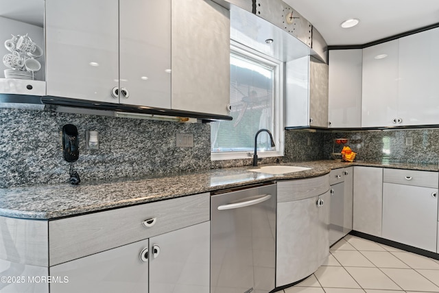 19 Dartmoor Dr, Manalapan, NJ 07726 - kitchen featuring a sink, white cabinets, dark stone counters, and tasteful backsplash
