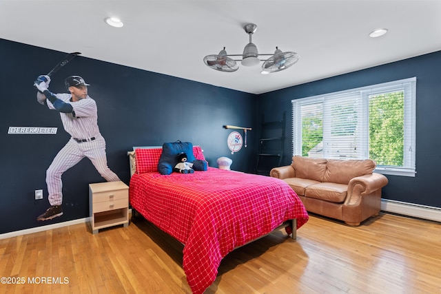 19 Dartmoor Dr, Manalapan, NJ 07726 - bedroom with wood finished floors, baseboard heating, baseboards, and recessed lighting