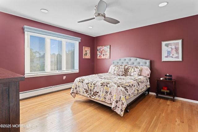 19 Dartmoor Dr, Manalapan, NJ 07726 - bedroom featuring baseboard heating, wood finished floors, ceiling fan, recessed lighting, and baseboards
