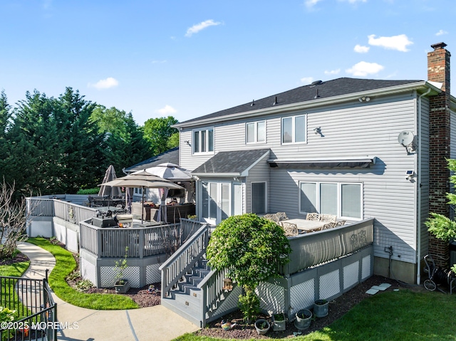 19 Dartmoor Dr, Manalapan, NJ 07726 - rear view of property with a wooden deck and a chimney