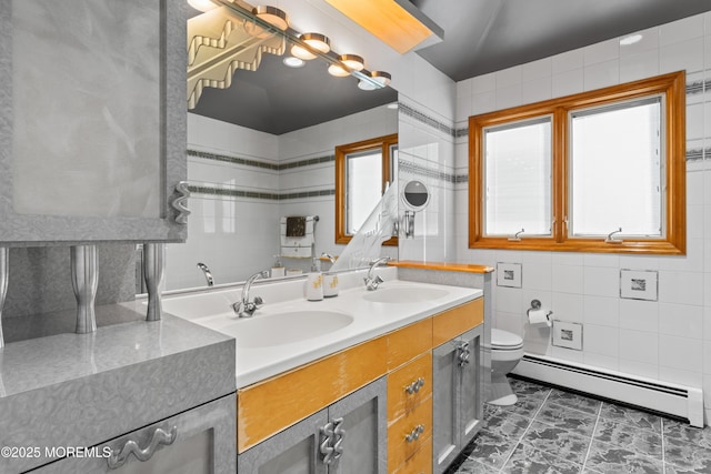 19 Dartmoor Dr, Manalapan, NJ 07726 - full bathroom featuring baseboard heating, double vanity, toilet, and tile walls