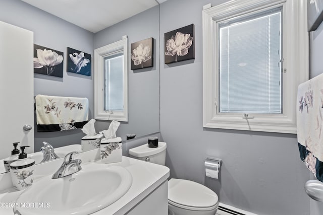 19 Dartmoor Dr, Manalapan, NJ 07726 - bathroom featuring toilet, vanity, and baseboard heating
